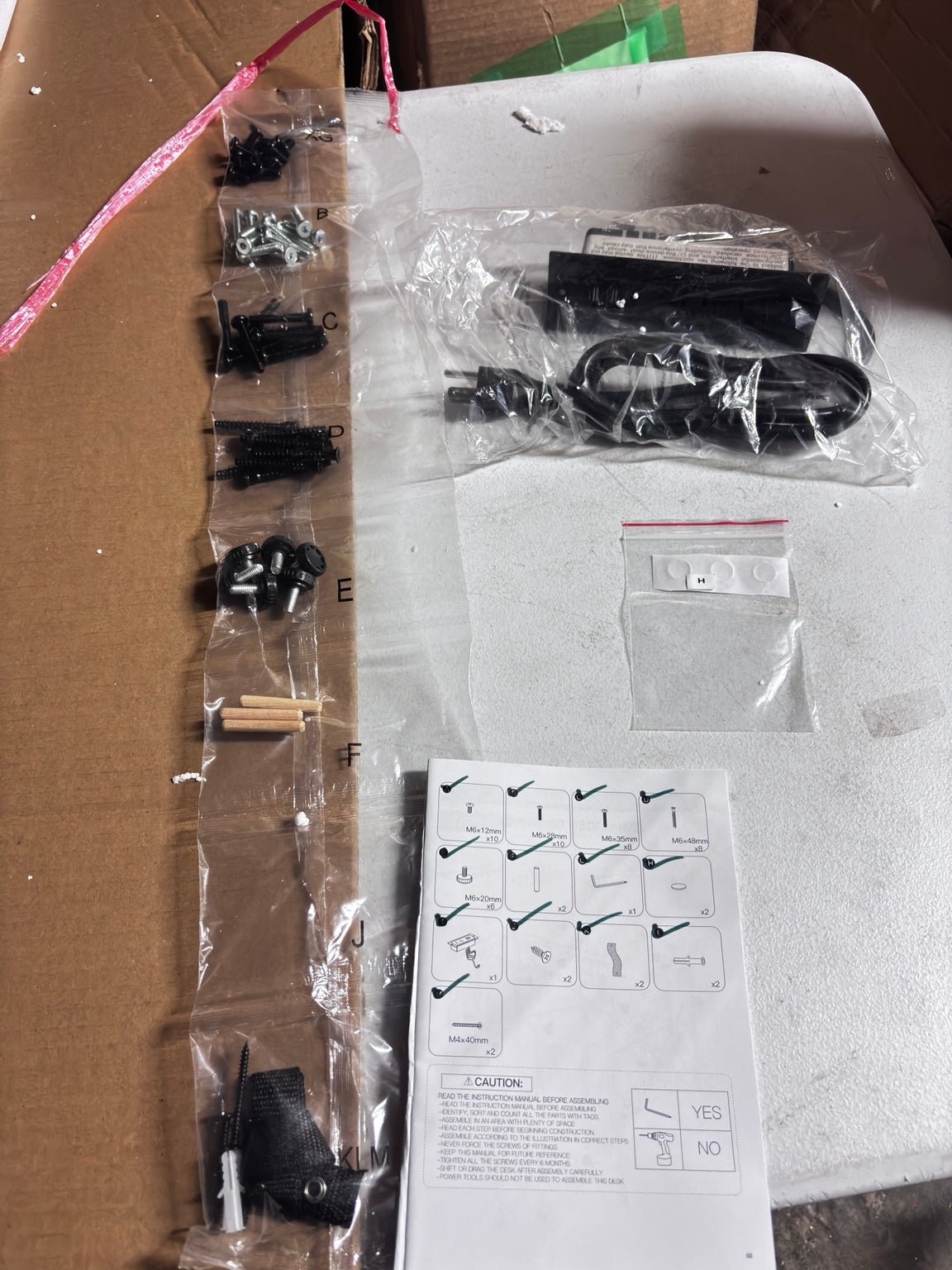 Actual DUMOS desk hardware and power strip inspected