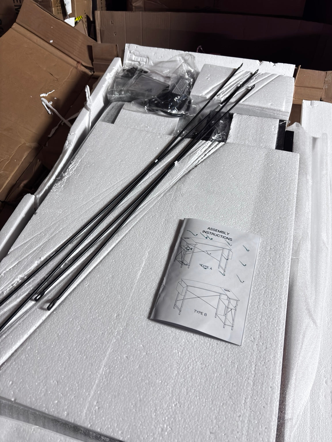 Actual DUMOS corner desk parts and assembly instructions inspected